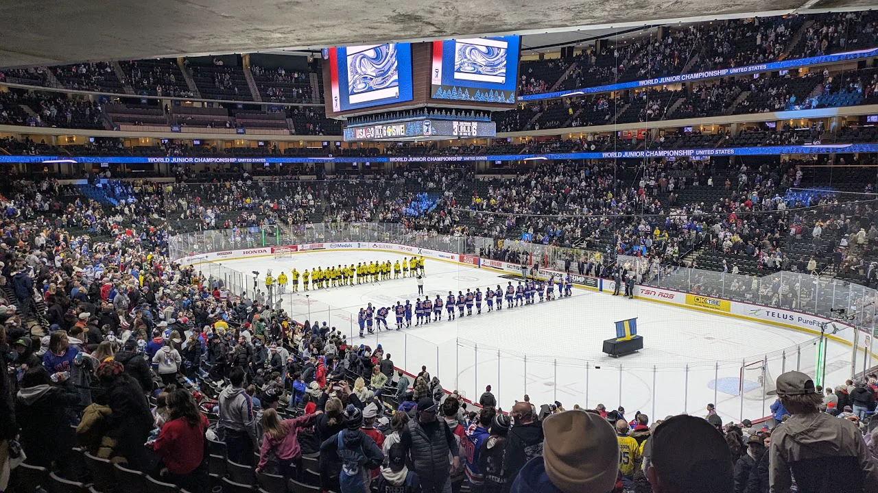 Teams lined up on the ice at a hockey championship