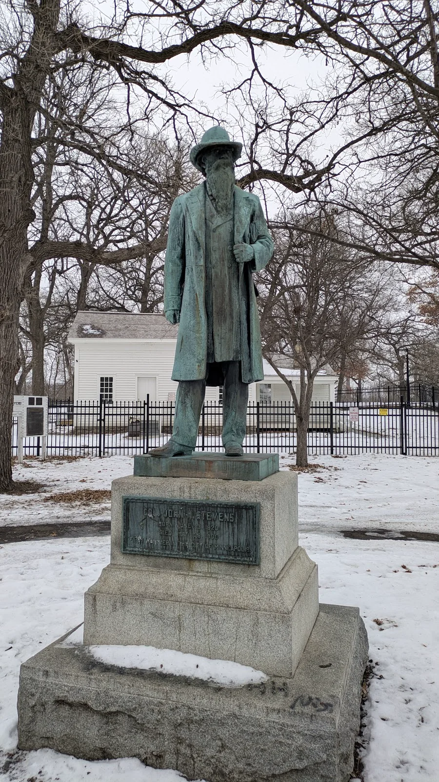 John H. Stevens statue in a snow-covered Minneapolis park